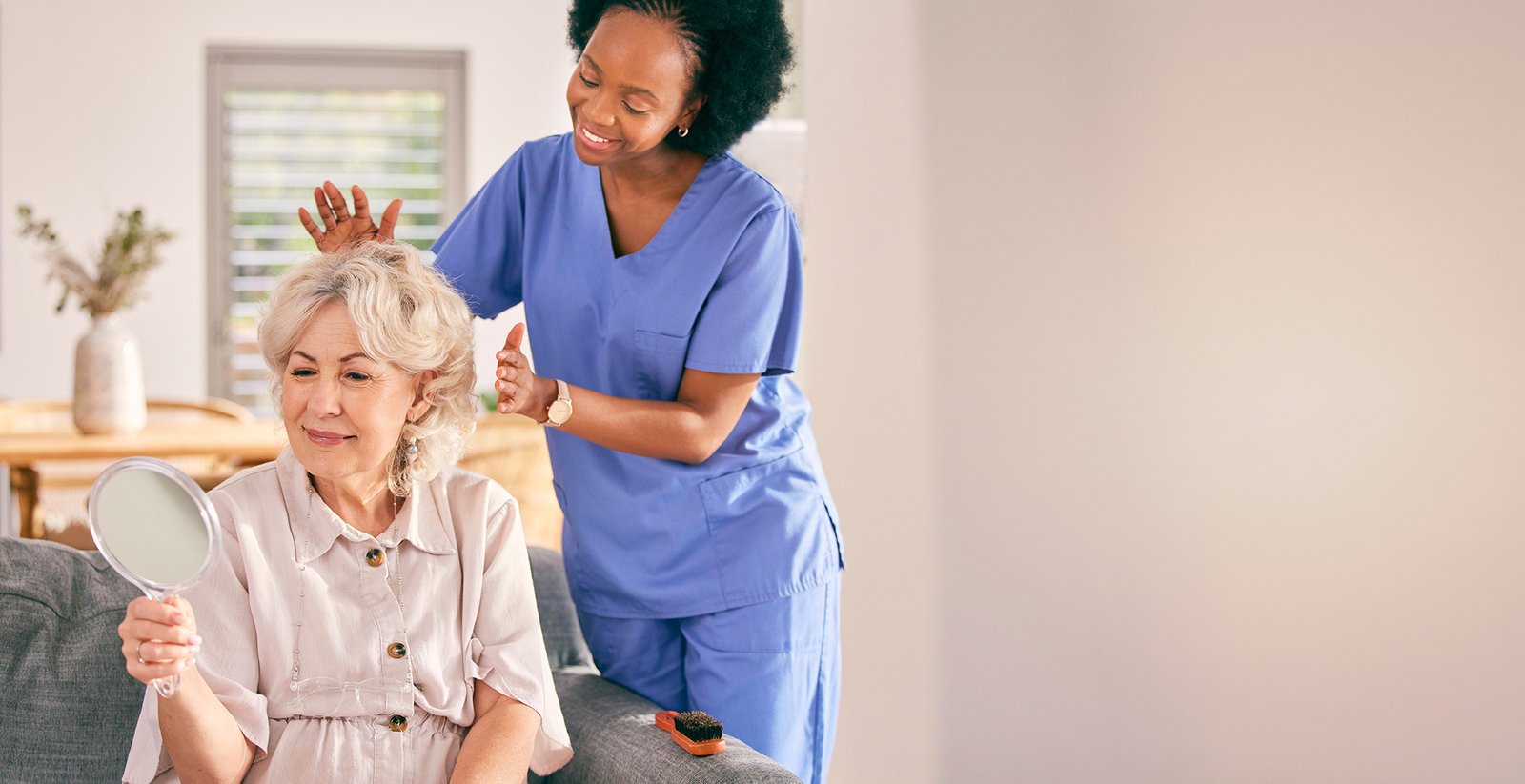 A Lynway carer supporting an older woman at home